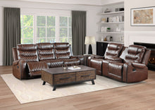 Brown reclining sofa set in a living room with wooden coffee table.