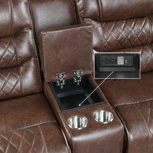 Brown recliner with cup holders and power outlet.