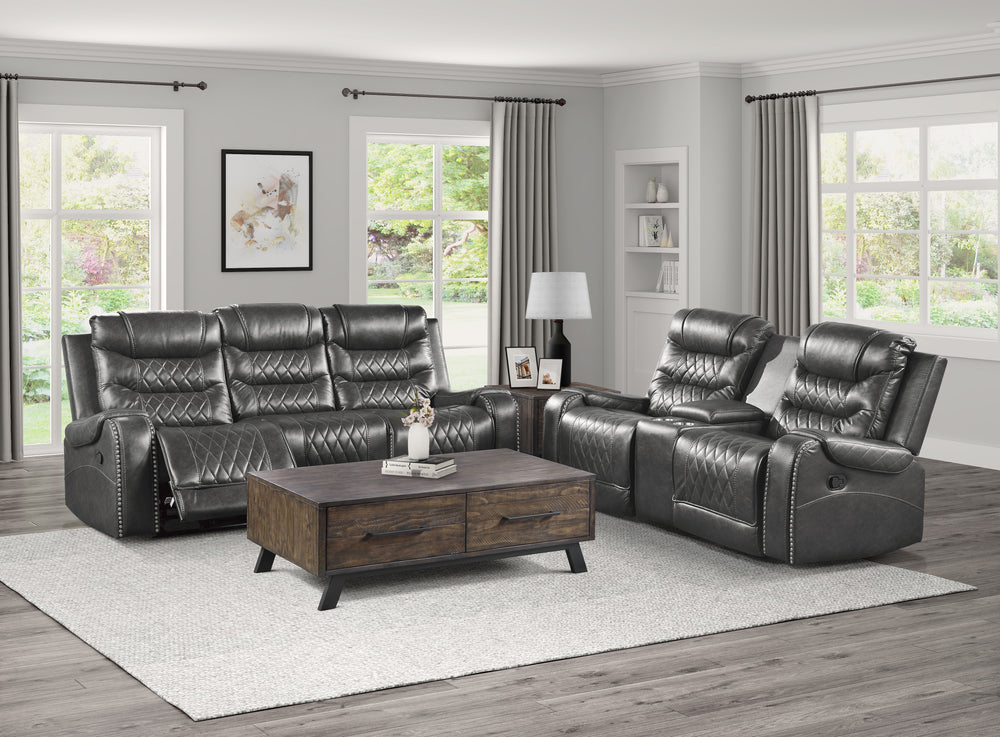 Gray reclining sofa set with a wooden coffee table in a living room.