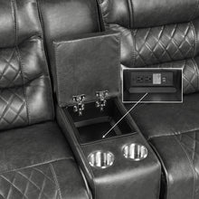 Gray recliner with cup holders and power outlet.