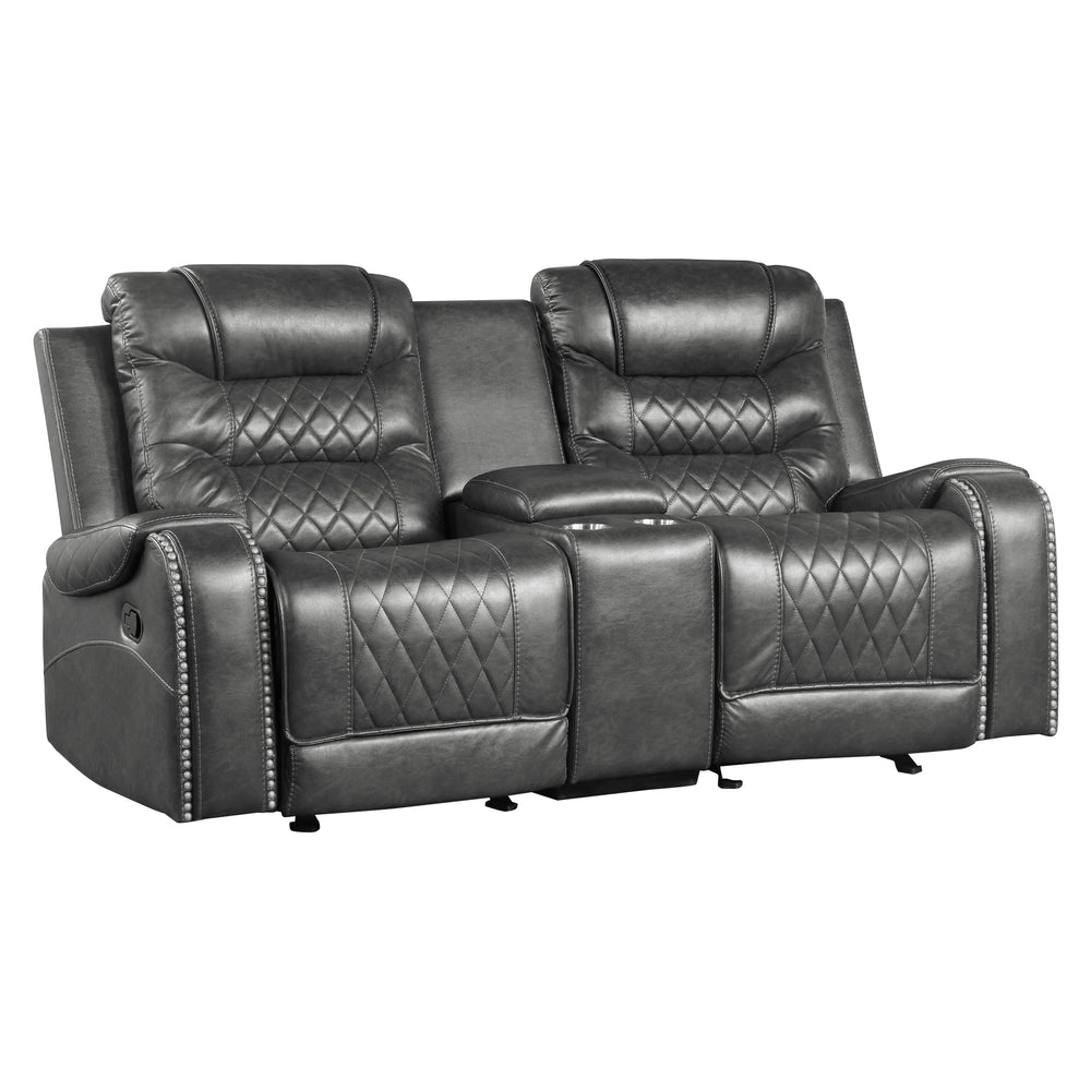 Gray recliner sofa with quilted design on a white background