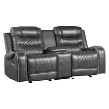 Gray recliner sofa with quilted design on a white background