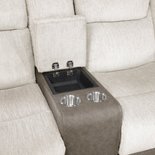 Intricate detail of a beige recliner with cup holders and a small sink embedded in the armrest.