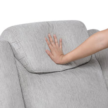 Gray sofa with a hand touching the backrest