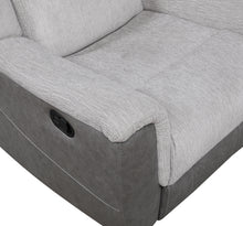 Close-up of a Gray recliner sofa with a visible power button.