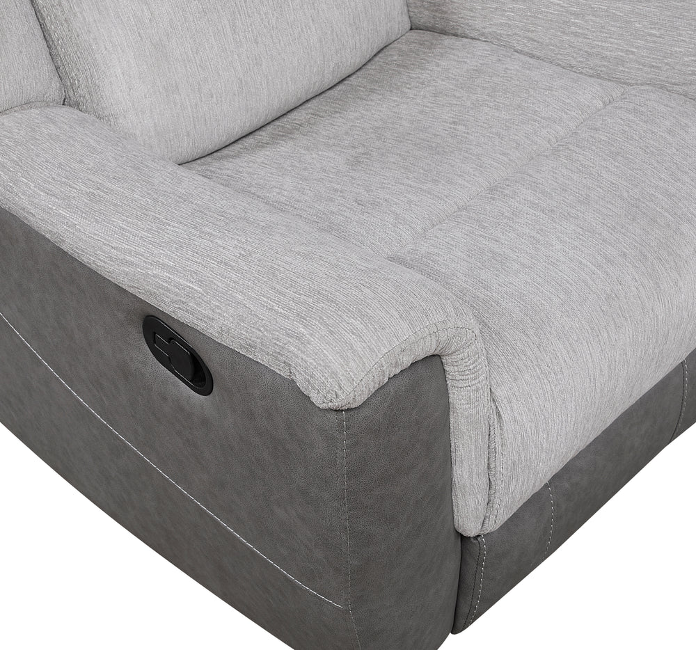 Close-up of a Gray recliner with a visible button.