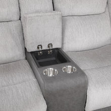 Gray loveseat with an embedded cup holder and tray