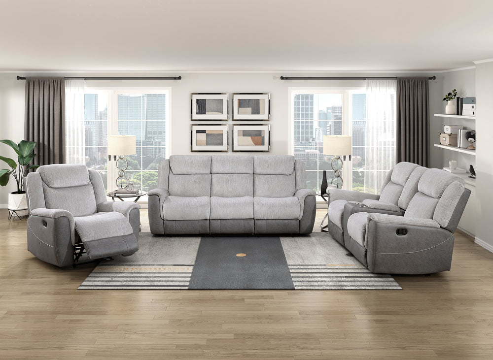 Gray sofa set in a living room with large windows and decor.
