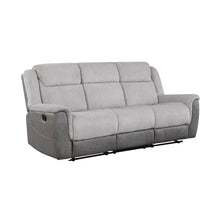 Gray sofa with reclining feature on a white background