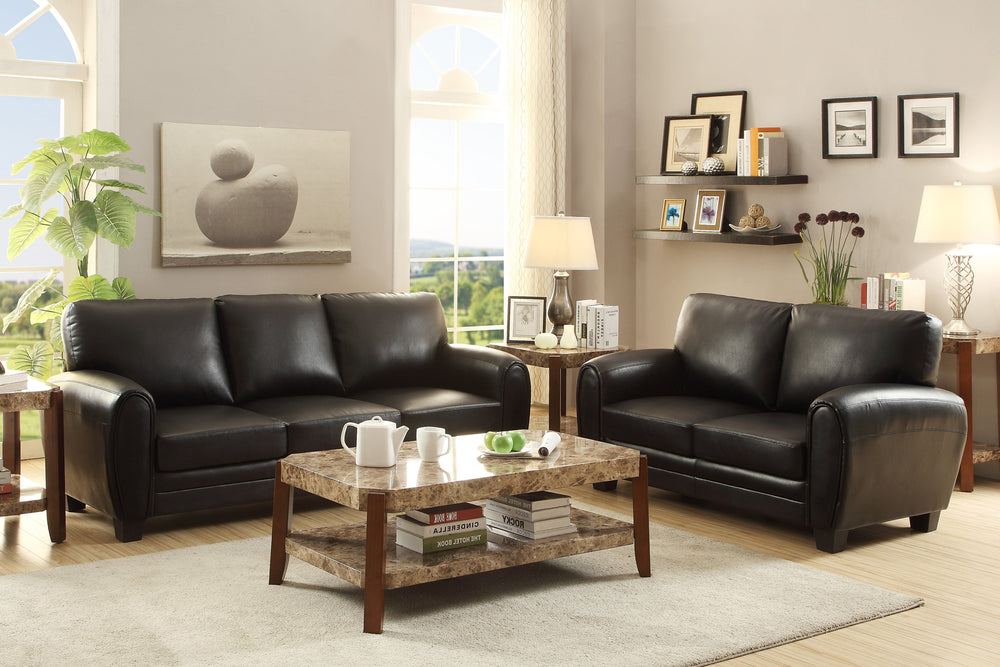 Living room with black sofa set and marble coffee table