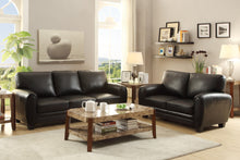 Living room with black sofa set and marble coffee table