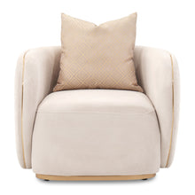 Beige armchair with a patterned pillow on a white background